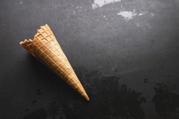 empty ice cream cone on a table, with copy space for individual text- Stock Photo or Stock Video of rcfotostock | RC Photo Stock