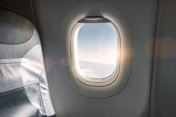 Empty seat on airplane during beautiful sunset. travel and airline business concept image : Stock Photo or Stock Video Download rcfotostock photos, images and assets rcfotostock | RC Photo Stock.: