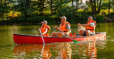 family canoeing on a river at summer mother and daughter paddling at front, father at the back in germany. Family on kayak ride. Wild nature and water fun on summer vacation.- Stock Photo or Stock Video of rcfotostock | RC Photo Stock