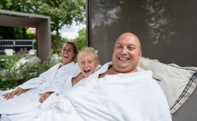 family father, mother, and daughter—laughing and relaxing in white robes at a spa wellness hotel outdoors : Stock Photo or Stock Video Download rcfotostock photos, images and assets rcfotostock | RC Photo Stock.: