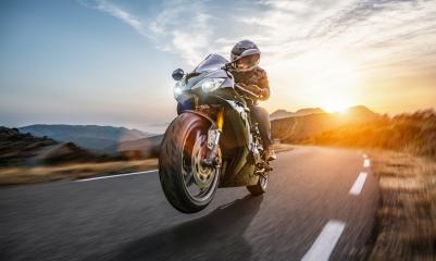 Fast motorbike on the coastal road riding. having fun driving the empty highway on a motorcycle tour journey- Stock Photo or Stock Video of rcfotostock | RC-Photo-Stock