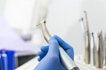female Dentist doctor hand holding dentist tools in Dentist Clinic : Stock Photo or Stock Video Download rcfotostock photos, images and assets rcfotostock | RC-Photo-Stock.: