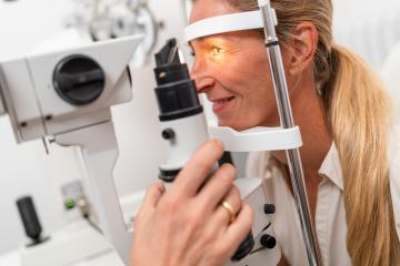 Female patient undergoing an eye examination with a focus on her illuminated eye using a slit lamp at the clinic. Close-up photo. Healthcare and medicine concept : Stock Photo or Stock Video Download rcfotostock photos, images and assets rcfotostock | RC Photo Stock.: