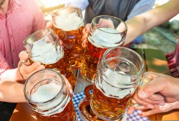 Five friends with a fresh beer in a Beer garden, close-up on beer stein oktoberst germany- Stock Photo or Stock Video of rcfotostock | RC Photo Stock