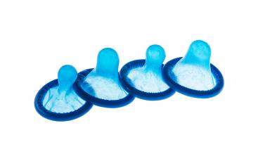 four blue condoms- Stock Photo or Stock Video of rcfotostock | RC-Photo-Stock