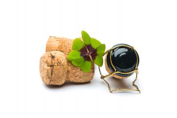 Four-leaf clover with champagne corks- Stock Photo or Stock Video of rcfotostock | RC-Photo-Stock