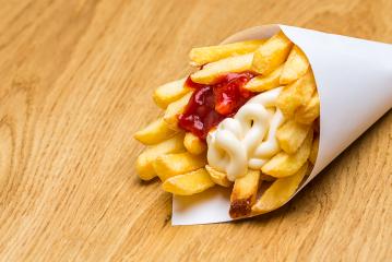 french fries in a bag with ketchup and mayonnaise- Stock Photo or Stock Video of rcfotostock | RC Photo Stock