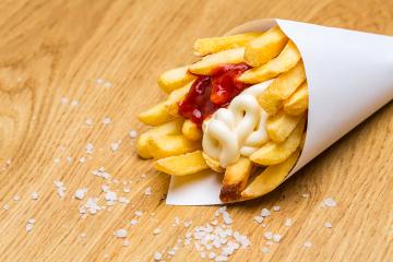 french fries in bag with salt on wood- Stock Photo or Stock Video of rcfotostock | RC Photo Stock