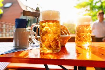 Fresh golden Beer in Bavarian beer garden on a sunny day- Stock Photo or Stock Video of rcfotostock | RC Photo Stock
