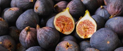 Fresh ripe figs with halved fig as background, Tropical fruit- Stock Photo or Stock Video of rcfotostock | RC Photo Stock