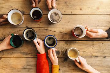 Friends group drinking coffee and cappuccino in a bar or restaurant - People hands cheering and toasting on top view point - breakfast together concept with white and black men and women- Stock Photo or Stock Video of rcfotostock | RC Photo Stock