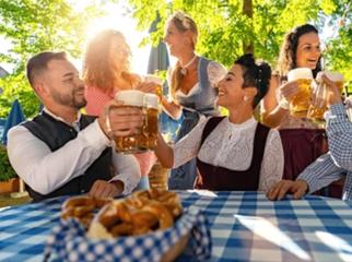Friends sitting in beer garden or oktoberfest with beer glasses toasting to each other in Bavaria, Germany : Stock Photo or Stock Video Download rcfotostock photos, images and assets rcfotostock | RC Photo Stock.: