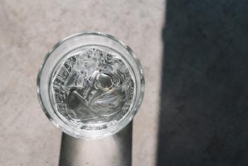 Glass with ice cubes on a table- Stock Photo or Stock Video of rcfotostock | RC Photo Stock