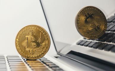golden bitcoin on notebook- Stock Photo or Stock Video of rcfotostock | RC-Photo-Stock