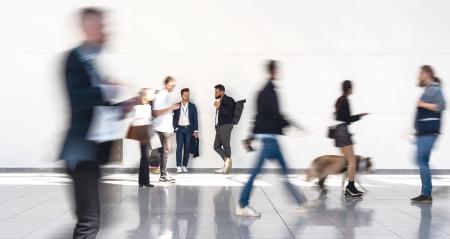 Group of business people is standing in anonymous blurred crowd at a trade fair- Stock Photo or Stock Video of rcfotostock | RC Photo Stock