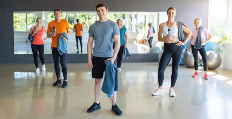 Group of people with gym equipment smiling and standing in a fitness center. Teamwork Concept image : Stock Photo or Stock Video Download rcfotostock photos, images and assets rcfotostock | RC Photo Stock.: