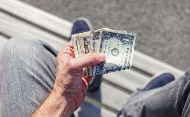 hand holding bunch of dollar notes : Stock Photo or Stock Video Download rcfotostock photos, images and assets rcfotostock | RC Photo Stock.: