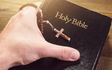 Hand holding Holy Bible with crucifix : Stock Photo or Stock Video Download rcfotostock photos, images and assets rcfotostock | RC-Photo-Stock.: