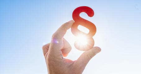 Hand holds paragraph symbol in the sun in the sky- Stock Photo or Stock Video of rcfotostock | RC Photo Stock