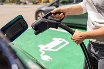 Hand inserting a DC CCS2 EV charging plug into electric car sock : Stock Photo or Stock Video Download rcfotostock photos, images and assets rcfotostock | RC Photo Stock.: