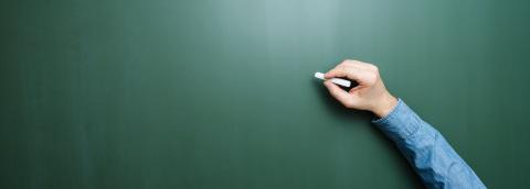 Hand of teacher holding chalk in front of blank blackboard- Stock Photo or Stock Video of rcfotostock | RC-Photo-Stock