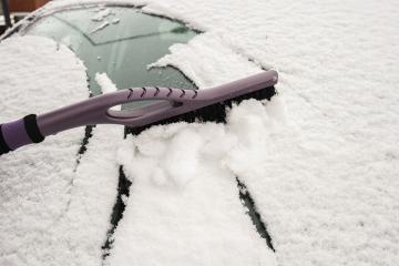 hand removing snow from car with a brush- Stock Photo or Stock Video of rcfotostock | RC Photo Stock