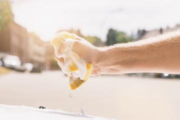hand wring out a sponge for washing car- Stock Photo or Stock Video of rcfotostock | RC-Photo-Stock