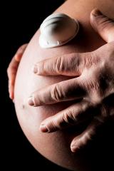 hands holding a belly of pregnant woman with worker helmet- Stock Photo or Stock Video of rcfotostock | RC-Photo-Stock