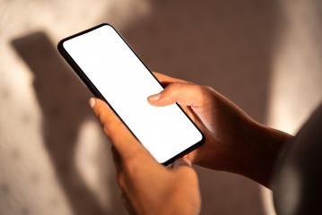 hands holding mobile phone with blank desktop screen at Home, Mockup image- Stock Photo or Stock Video of rcfotostock | RC-Photo-Stock