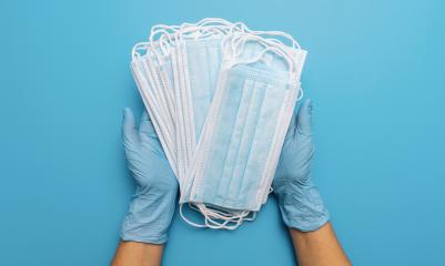 Hands in gloves showing many medical face mask on blue background. Preventive measures to protect against Covid-19 Corona virus infection.- Stock Photo or Stock Video of rcfotostock | RC-Photo-Stock