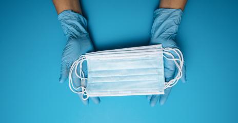 Hands in gloves showing many medical face mask on blue background. Preventive measures to protect against Covid-19 Corona virus infection.- Stock Photo or Stock Video of rcfotostock | RC Photo Stock
