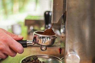 Hands of barista holding portafilter filled with ground coffee preparing to brew with machine : Stock Photo or Stock Video Download rcfotostock photos, images and assets rcfotostock | RC Photo Stock.: