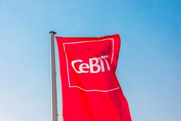 HANNOVER, GERMANY MARCH, 2017: Cebit sign on a flag against blue sky. The Cebit is the biggest trade fair for information technology in the world.- Stock Photo or Stock Video of rcfotostock | RC Photo Stock