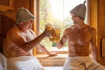 happy german men in finnish sauna wearing felt hats toasting withgerman beer´mug. Hotel spa okotoberfest concept image : Stock Photo or Stock Video Download rcfotostock photos, images and assets rcfotostock | RC Photo Stock.: