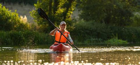 Happy man has fun on a kayak tour on a river : Stock Photo or Stock Video Download rcfotostock photos, images and assets rcfotostock | RC Photo Stock.: