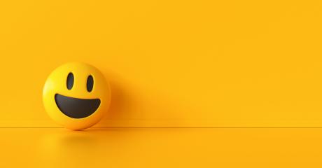 happy smiley emoji on a yellowwall- Stock Photo or Stock Video of rcfotostock | RC Photo Stock