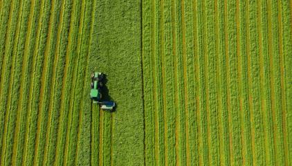 Harvesting hay in summer. Combine harvester of an agricultural machine collects ripe grass on the field. View from above. - Stock Photo or Stock Video of rcfotostock | RC Photo Stock