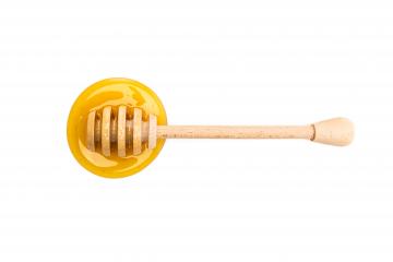 honey dipper lies in honey : Stock Photo or Stock Video Download rcfotostock photos, images and assets rcfotostock | RC-Photo-Stock.: