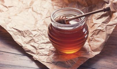 Honey in a pot or jar on paper with Honey dipper- Stock Photo or Stock Video of rcfotostock | RC-Photo-Stock