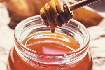 Honey runs from a dipper in to a glass of jar : Stock Photo or Stock Video Download rcfotostock photos, images and assets rcfotostock | RC-Photo-Stock.: