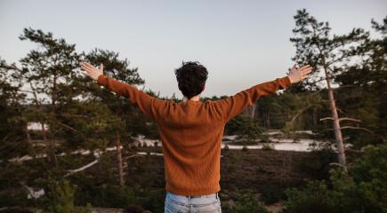 Hopeful, thoughtful young man with arms wide open. Joyfully stretches his hands up in the air. Man is positive and he enjoys life. - Stock Photo or Stock Video of rcfotostock | RC Photo Stock