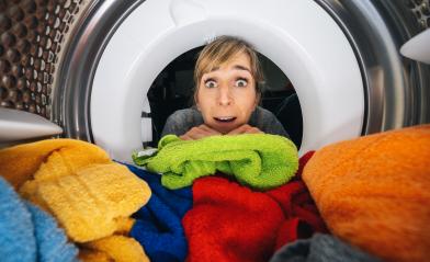Housewife Reaching Inside a washing machine or dryer at Home view from washing machine inside- Stock Photo or Stock Video of rcfotostock | RC Photo Stock
