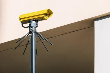 IP CCTV camera in Yellow color install by have water proof cover to protect camera with home security system concept image- Stock Photo or Stock Video of rcfotostock | RC Photo Stock