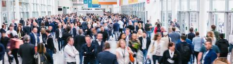 large crowd of anonymous blurred people at a trade show- Stock Photo or Stock Video of rcfotostock | RC Photo Stock