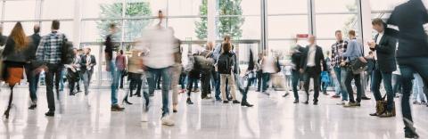 large crowd of anonymous blurred people at a trade show hall- Stock Photo or Stock Video of rcfotostock | RC Photo Stock