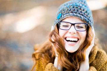 Laughing woman with glasses, red hair, and a knit hat outdoors in a soft autumn background
- Stock Photo or Stock Video of rcfotostock | RC Photo Stock