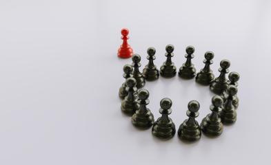 Leadership concept, red pawn of chess, standing out from the crowd of blacks, with empty space on left side : Stock Photo or Stock Video Download rcfotostock photos, images and assets rcfotostock | RC Photo Stock.: