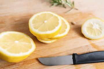 Lemon slices on a wooden cutting board table- Stock Photo or Stock Video of rcfotostock | RC-Photo-Stock