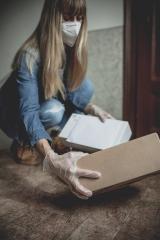 letter carrier drops letters and packages in the hallway without contact in times of quarantine with gloves and ffp2 face mask : Stock Photo or Stock Video Download rcfotostock photos, images and assets rcfotostock | RC Photo Stock.: