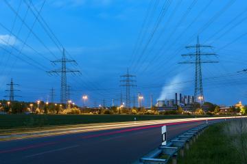Light trails at night on a brown cole power station electricity Pylon landscape- Stock Photo or Stock Video of rcfotostock | RC Photo Stock